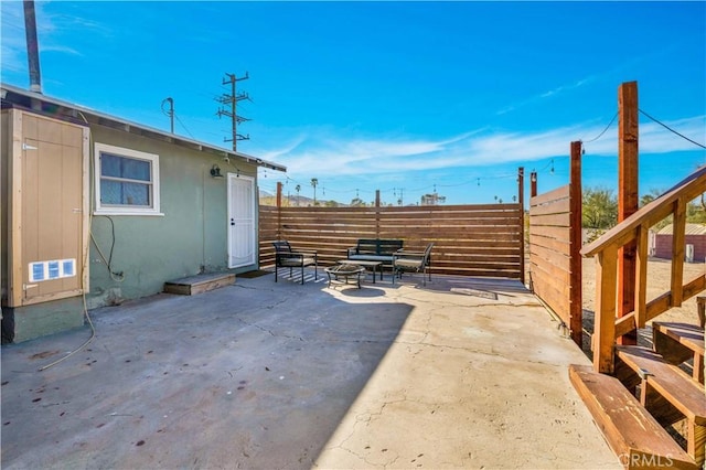 view of patio with an outdoor fire pit