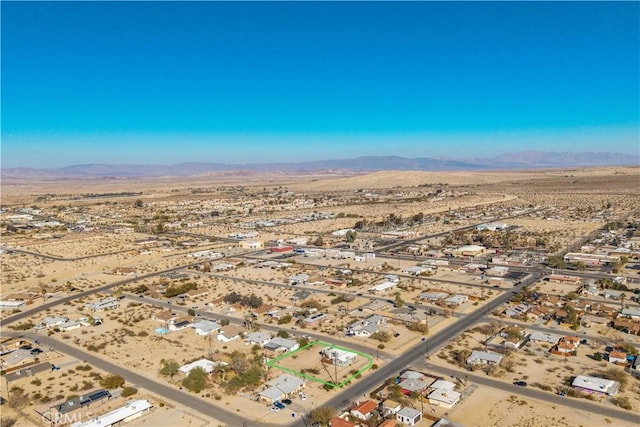 drone / aerial view featuring a mountain view