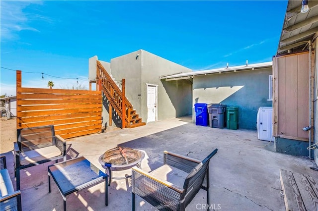 view of patio featuring an outdoor fire pit