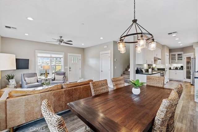 dining space featuring hardwood / wood-style floors and ceiling fan