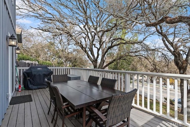 wooden deck featuring grilling area