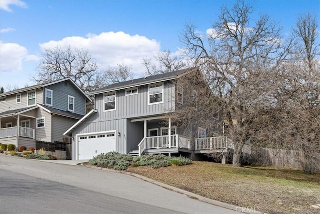 view of front of house with a wooden deck and a garage