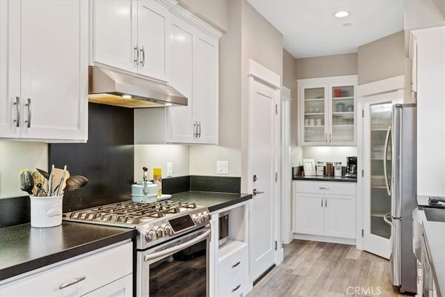 kitchen featuring appliances with stainless steel finishes, light hardwood / wood-style floors, and white cabinets