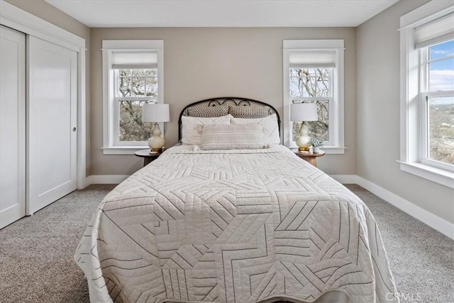 carpeted bedroom with a closet