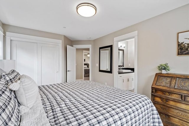 bedroom featuring ensuite bath and a closet