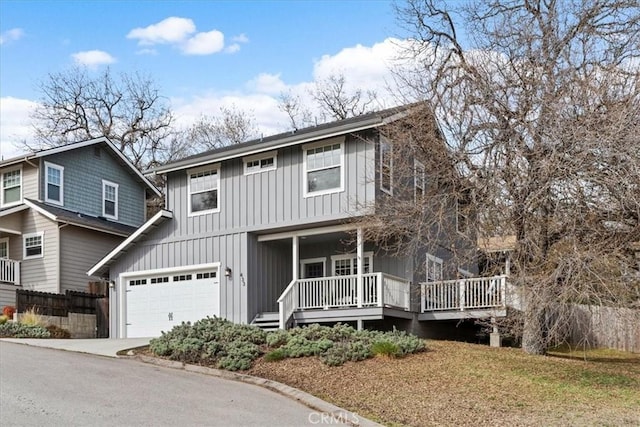 view of front facade featuring a garage and covered porch