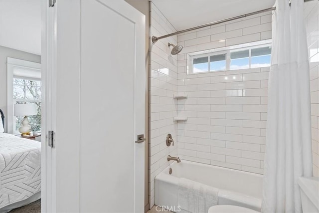 bathroom with shower / bathtub combination with curtain