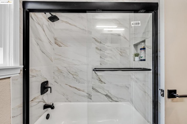 bathroom featuring enclosed tub / shower combo