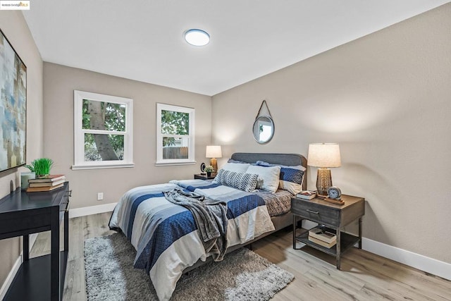 bedroom with light wood-type flooring