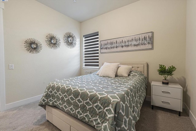 bedroom featuring dark carpet