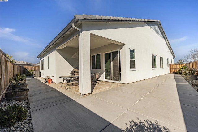 rear view of house with a patio