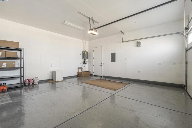 garage with a garage door opener, electric panel, and water heater