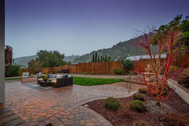 view of patio featuring a mountain view and outdoor lounge area