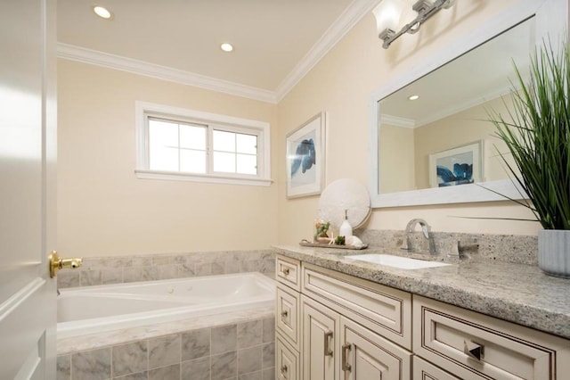 bathroom with tiled tub, crown molding, and vanity