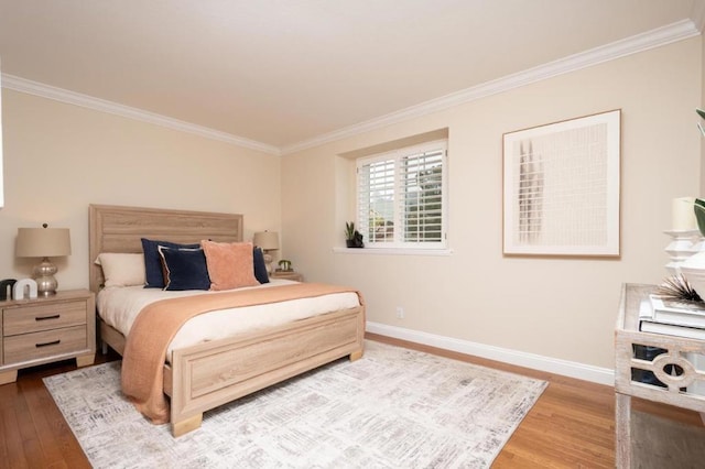 bedroom featuring crown molding and wood-type flooring