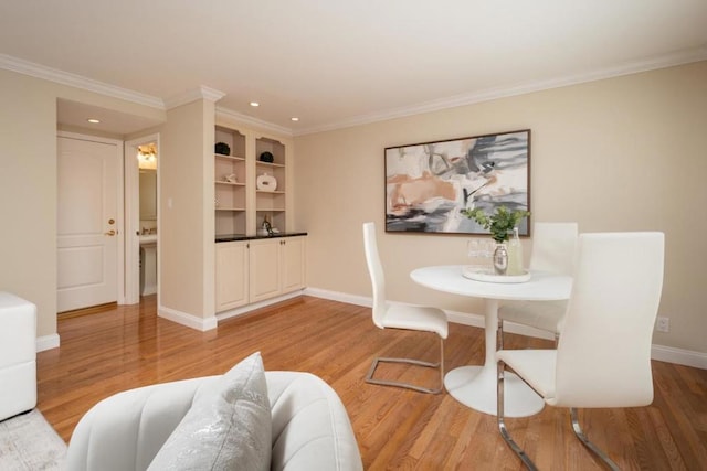 dining room featuring ornamental molding and wood-type flooring