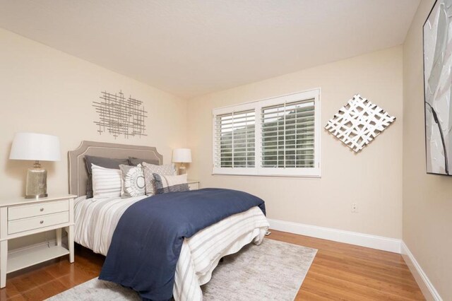 bedroom featuring hardwood / wood-style flooring