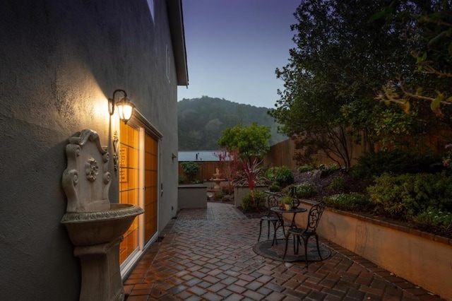 view of patio terrace at dusk