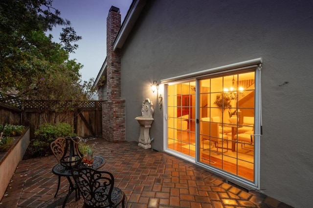 view of patio terrace at dusk