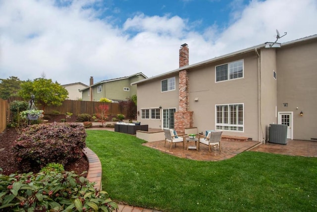 rear view of house with a lawn, outdoor lounge area, a patio, and central air condition unit