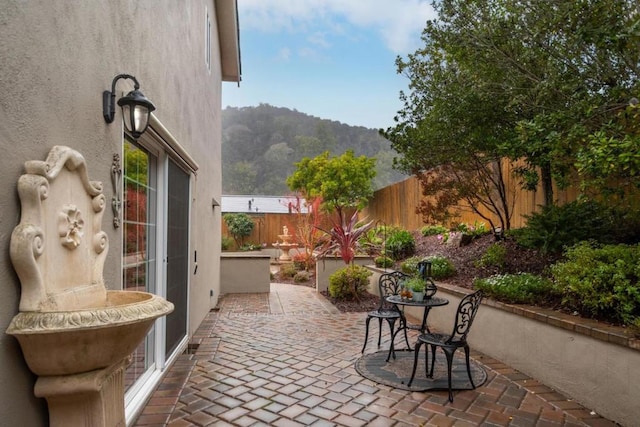 view of patio / terrace featuring a mountain view