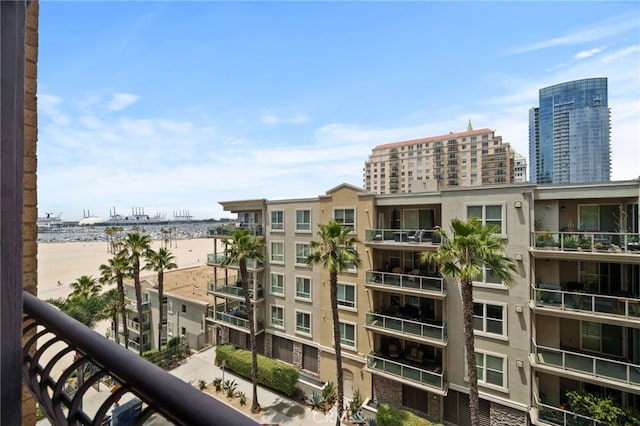 exterior space with a water view and a beach view