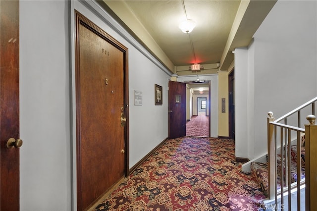 hall featuring carpet flooring