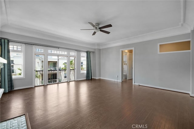 unfurnished living room with ceiling fan, plenty of natural light, crown molding, and dark hardwood / wood-style flooring