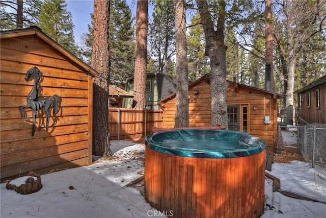 exterior space featuring a hot tub