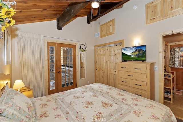 bedroom with access to outside, lofted ceiling with beams, french doors, and wooden ceiling