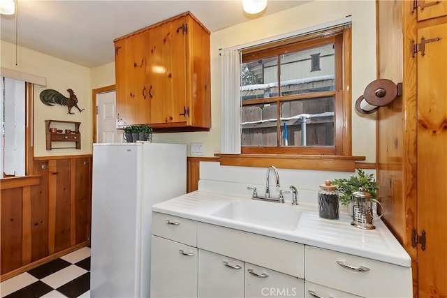 bathroom featuring vanity and wooden walls