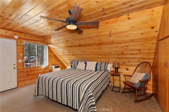 carpeted bedroom featuring wood ceiling and wood walls