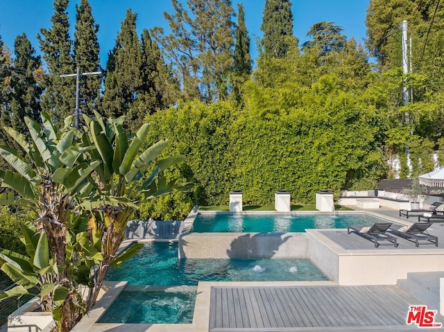 view of pool featuring pool water feature