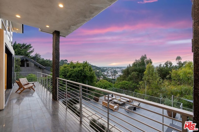 view of balcony at dusk