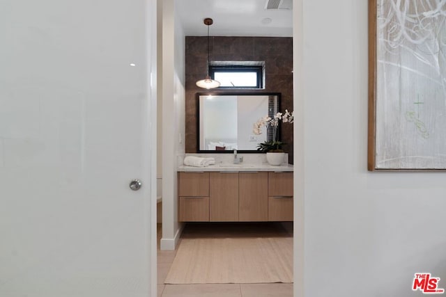 bathroom featuring vanity and tile patterned flooring