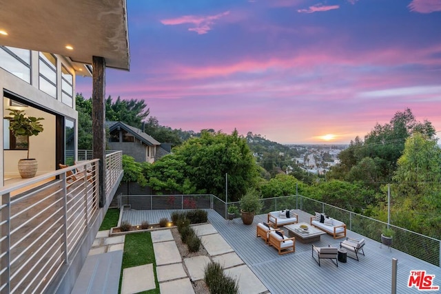 patio terrace at dusk with an outdoor living space