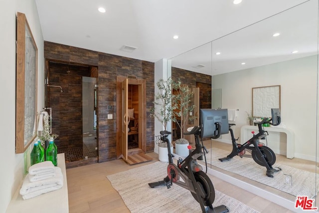 workout area featuring light wood-type flooring