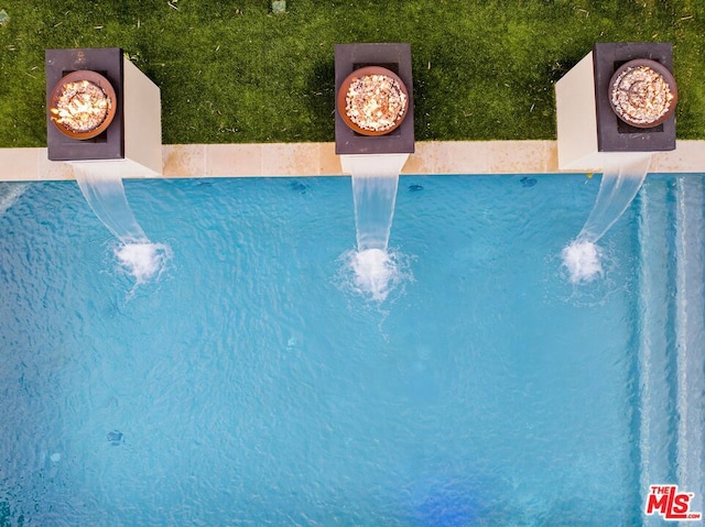 view of pool featuring pool water feature