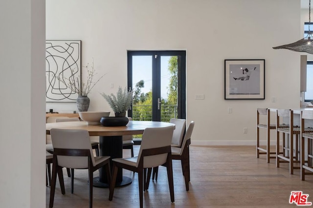 dining room featuring french doors and hardwood / wood-style floors