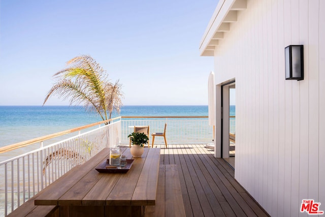 wooden terrace with a water view