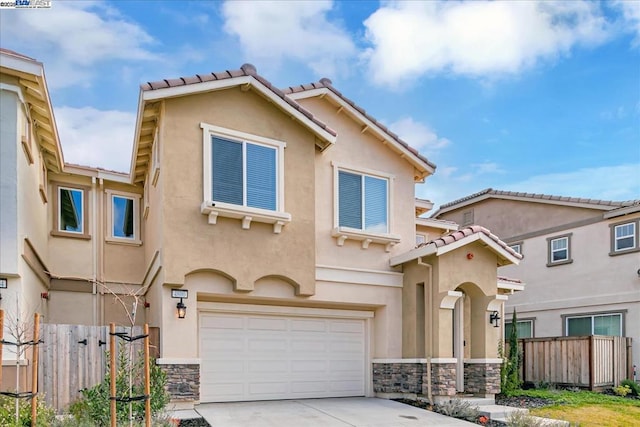 view of front of home with a garage