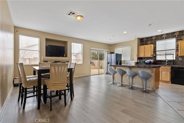 dining room with light hardwood / wood-style flooring