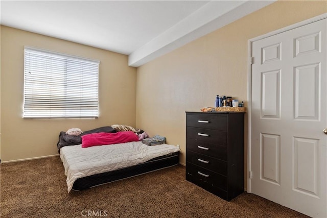 bedroom featuring dark colored carpet