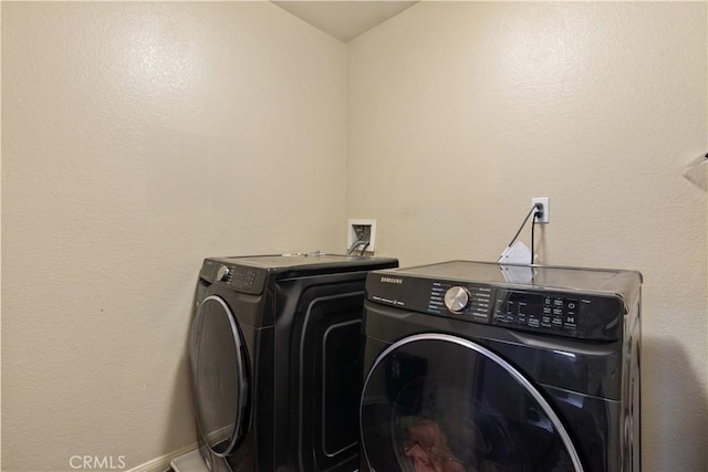 laundry area with washing machine and dryer