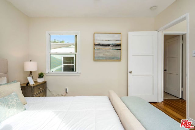 bedroom featuring hardwood / wood-style flooring