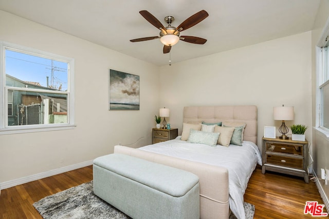 bedroom with dark wood-type flooring and ceiling fan