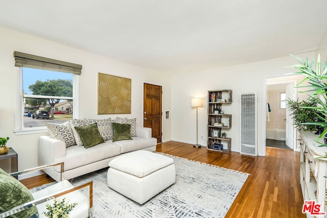 living room featuring dark hardwood / wood-style floors