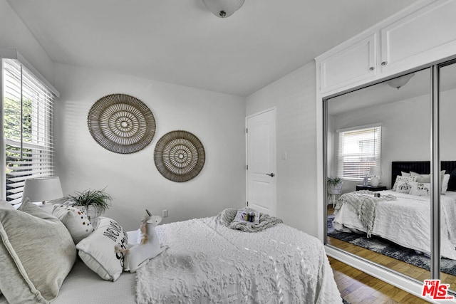 bedroom featuring hardwood / wood-style floors