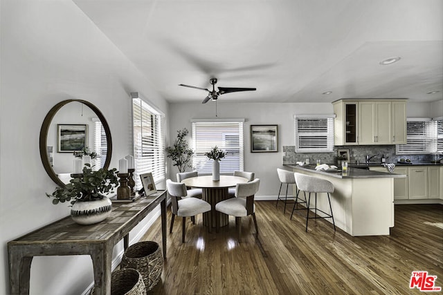 dining space featuring dark hardwood / wood-style floors and ceiling fan