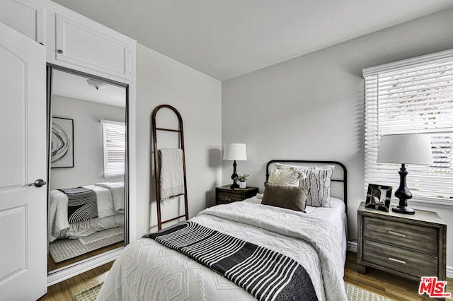 bedroom with wood-type flooring